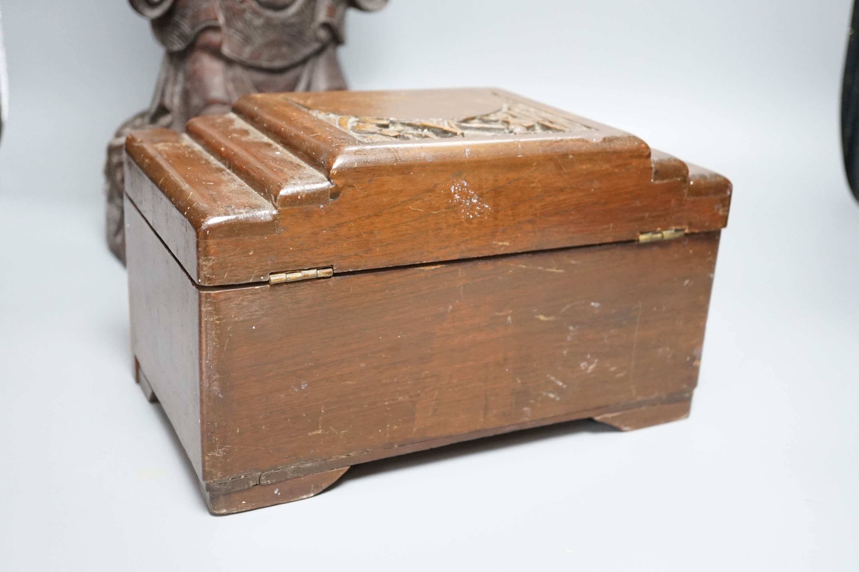 A Chinese carved wood sage and small carved trunk, Sage 47 cms high.